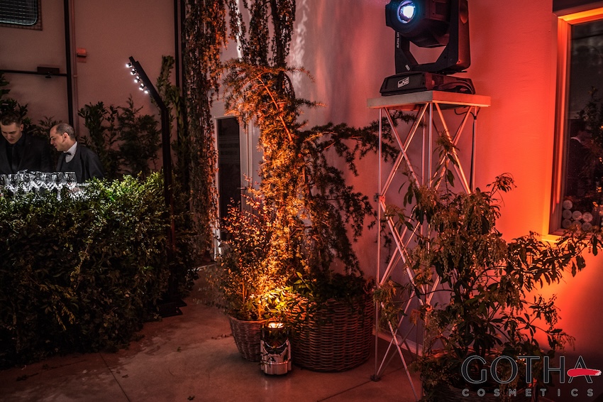 Scenic setup with plants and atmospheric lighting for a Gotha Cosmetics evening event. - ACCAELLE Events | Organizzazione eventi e Wedding planner
