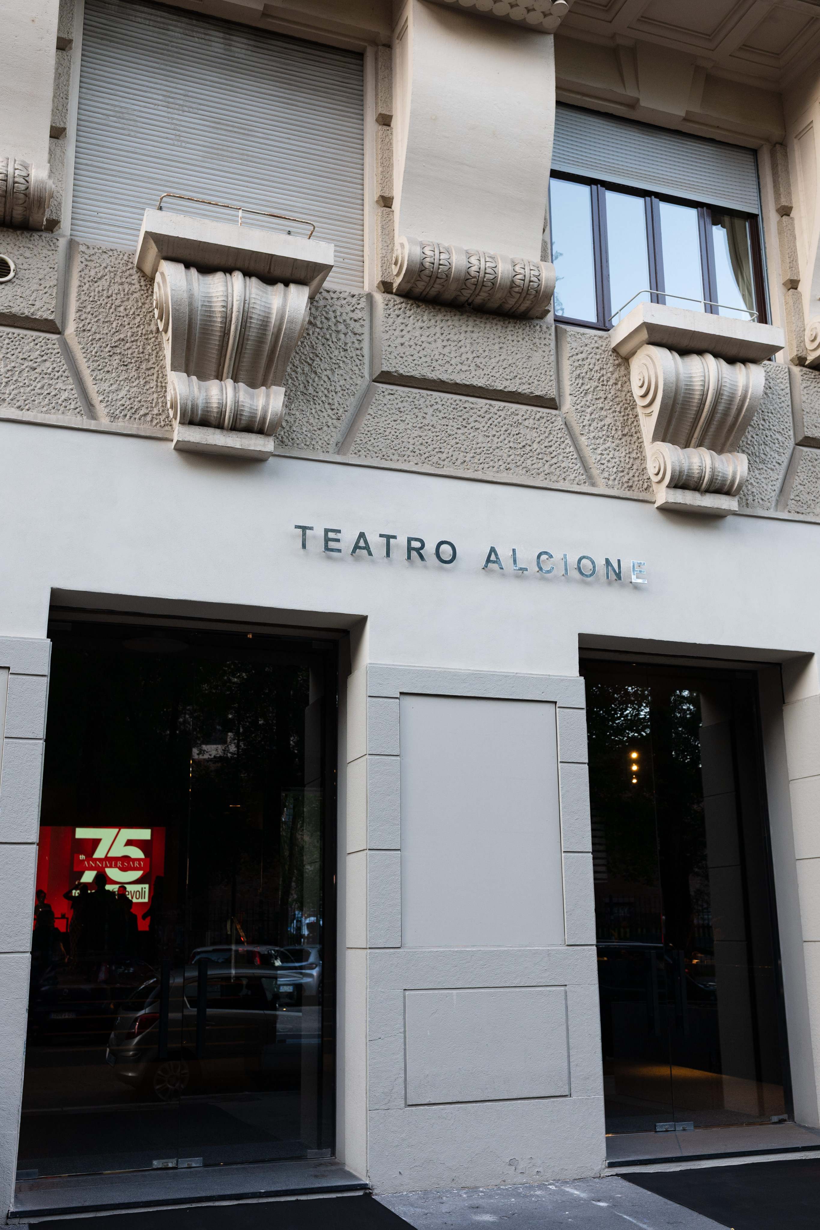 External entrance of the Alcione Theatre with glass doors opening onto the street. - ACCAELLE Events | Organizzazione eventi e Wedding planner