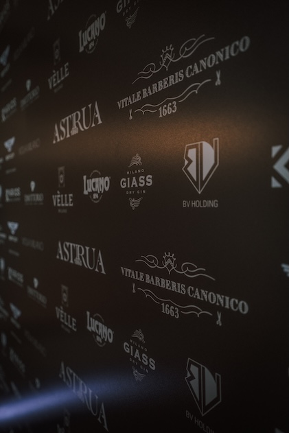 Black wall depicting various brands - ACCAELLE Events | Organizzazione eventi e Wedding planner