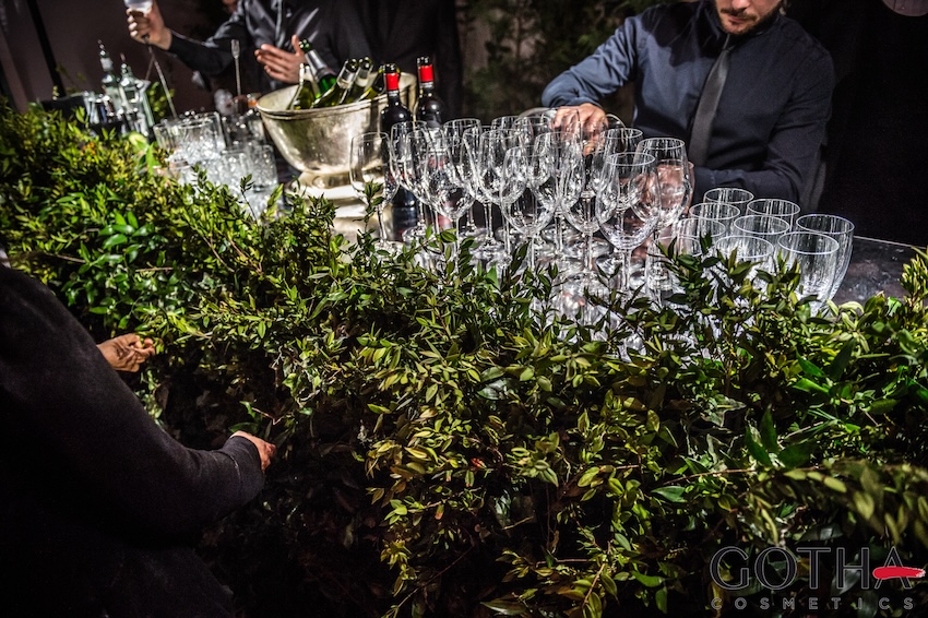 Catering service with a bar counter decorated with greenery at a Gotha Cosmetics event. - ACCAELLE Events | Organizzazione eventi e Wedding planner